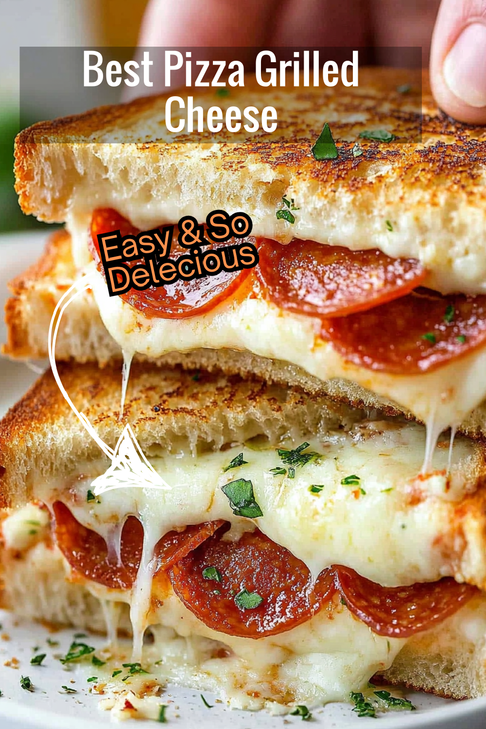 This Pizza Grilled Cheese Recipe combines the best of both worlds: cheesy, gooey grilled cheese with savory pepperoni, perfect for a quick meal!