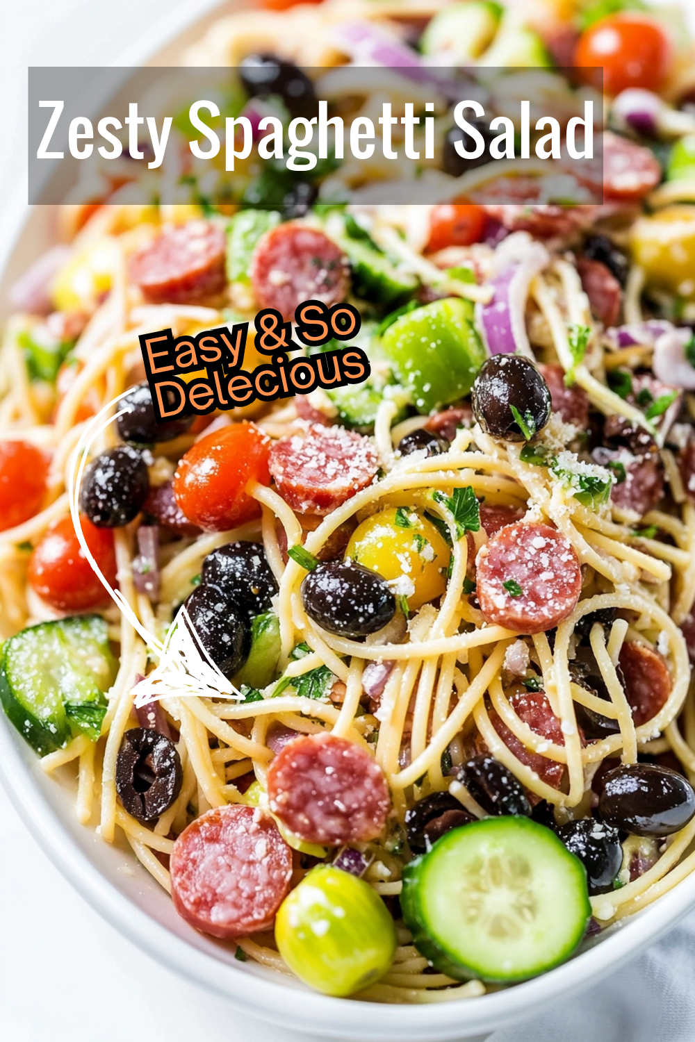 Tossed with cherry tomatoes, cucumbers, olives, and salami, this spaghetti salad is topped with a tangy Italian dressing. A refreshing dish for any gathering!