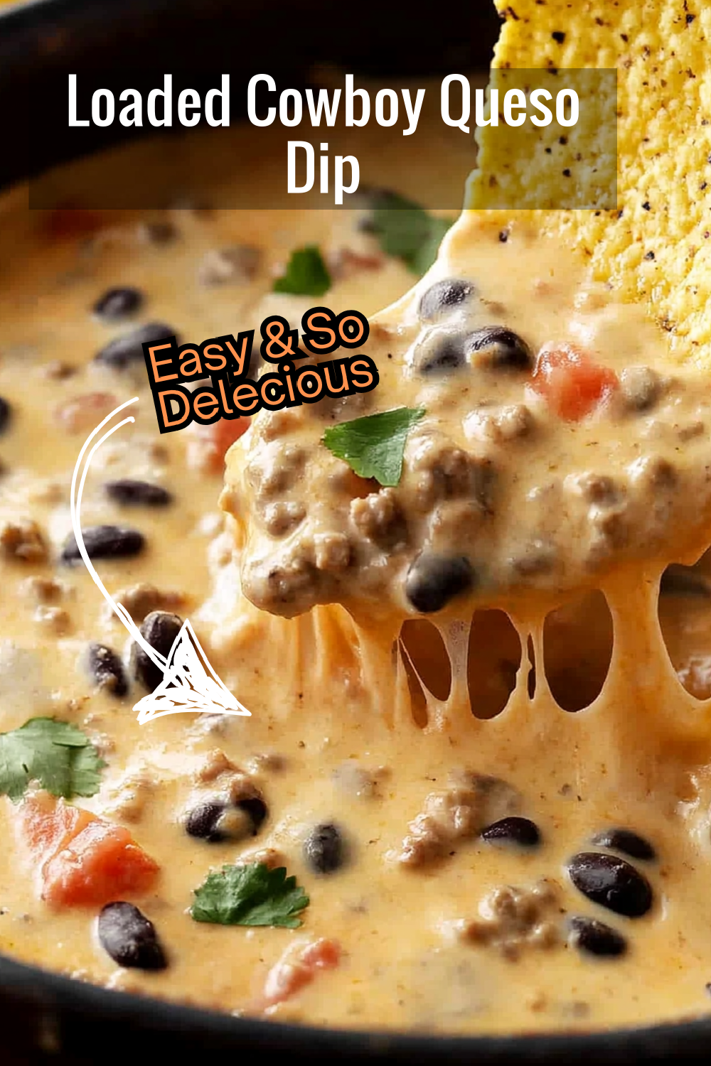 Packed with cheese, seasoned beef, black beans, and tomatoes—this loaded Cowboy Queso Dip has it all!