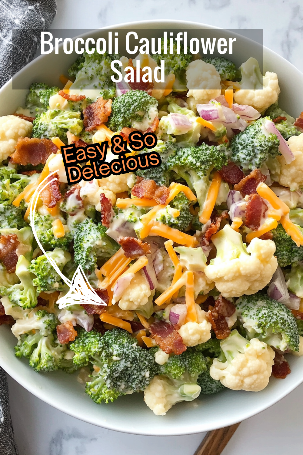 Enjoy a refreshing bite with this broccoli cauliflower salad, filled with crisp veggies, smoky bacon, and creamy dressing.