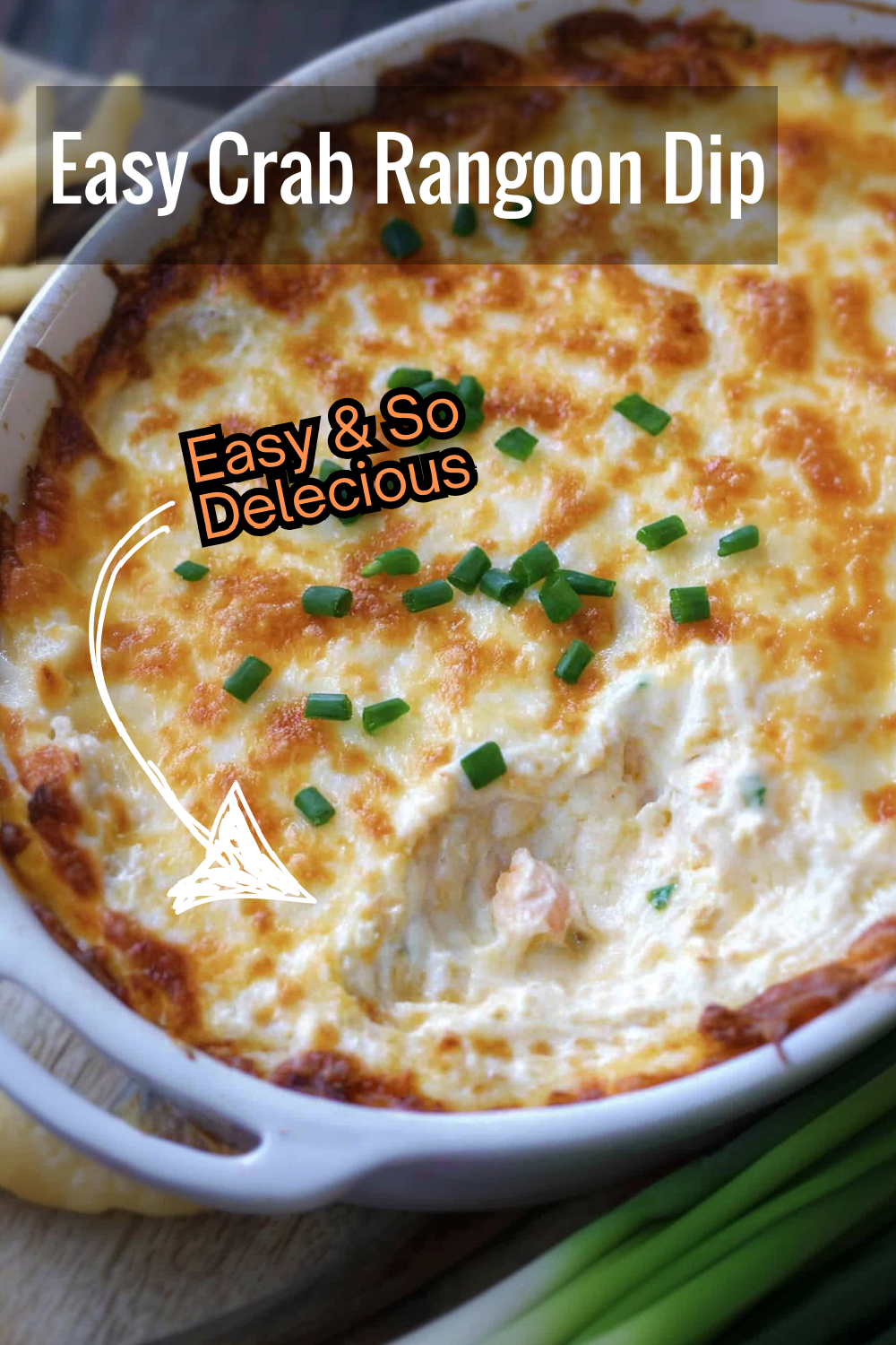 Whip up this easy Crab Rangoon Dip for your next get-together! Packed with crab and cheesy goodness, this dip is golden-broiled for extra flavor and topped with crispy chives and wontons.