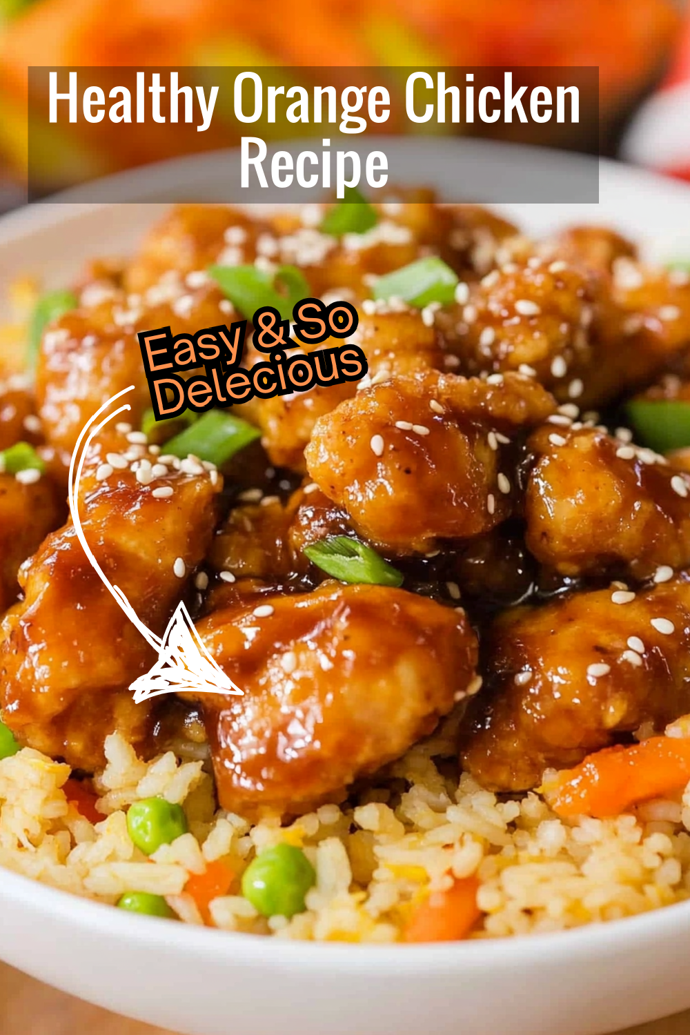 Try this healthy slow cooker orange chicken recipe! Tender chicken glazed in a homemade orange sauce, served over fried rice with colorful veggies.