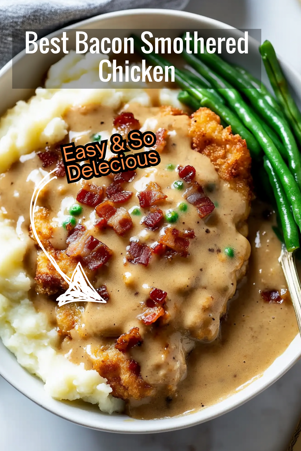 This smothered chicken recipe pairs crispy, golden-brown chicken breasts with a luscious gravy and crunchy bacon. The perfect combination of textures and flavors in one dish!