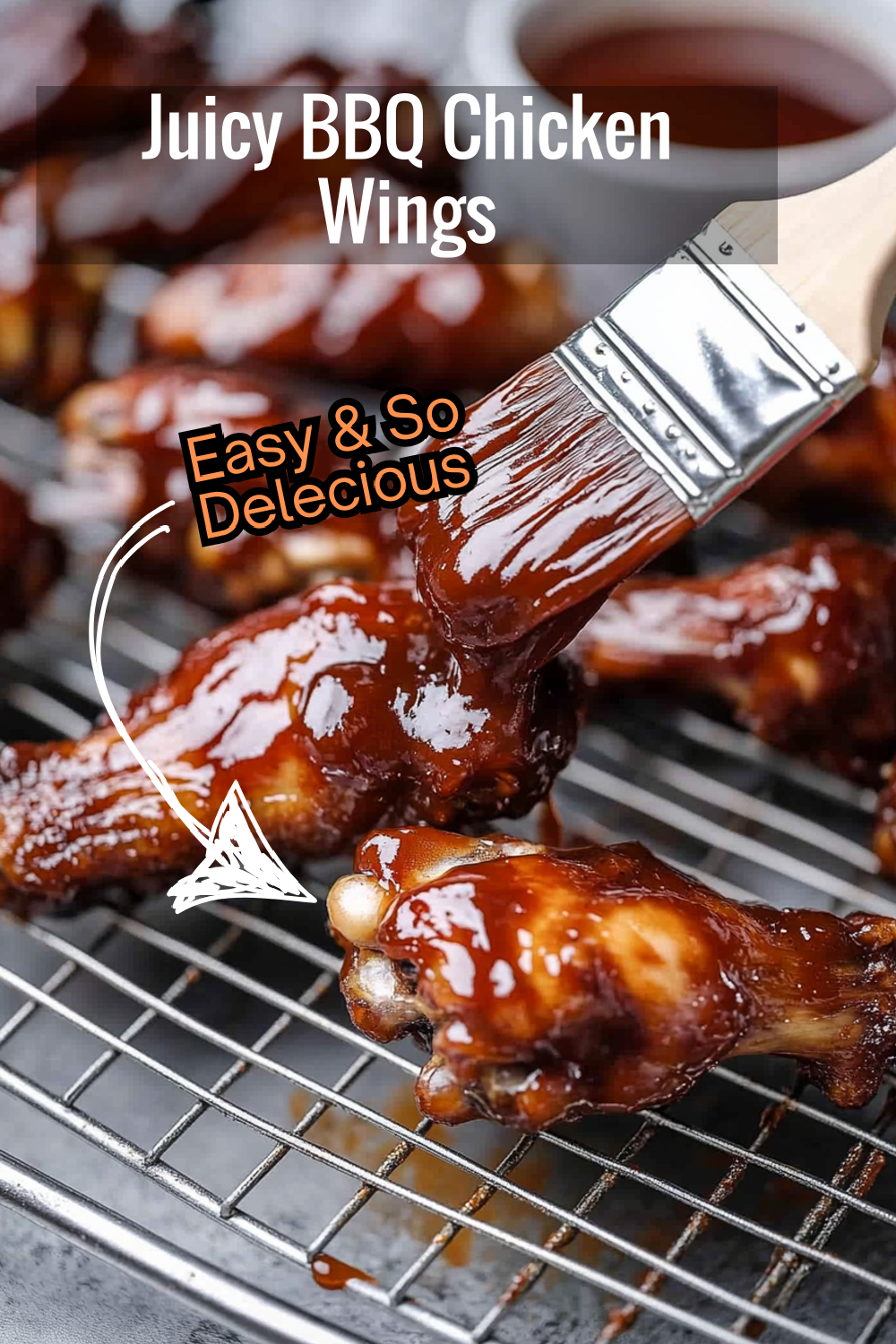 These oven-baked chicken wings are coated with a thick layer of glossy BBQ sauce, perfect for any barbecue lover.