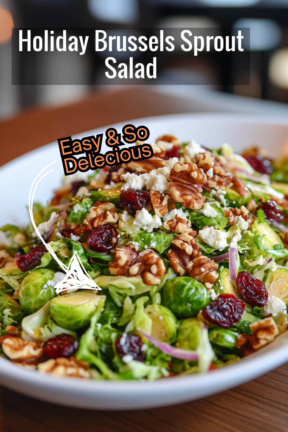 Perfect for holiday gatherings, this Brussels sprout salad with goat cheese, cranberries, and walnuts is a crowd-pleaser!