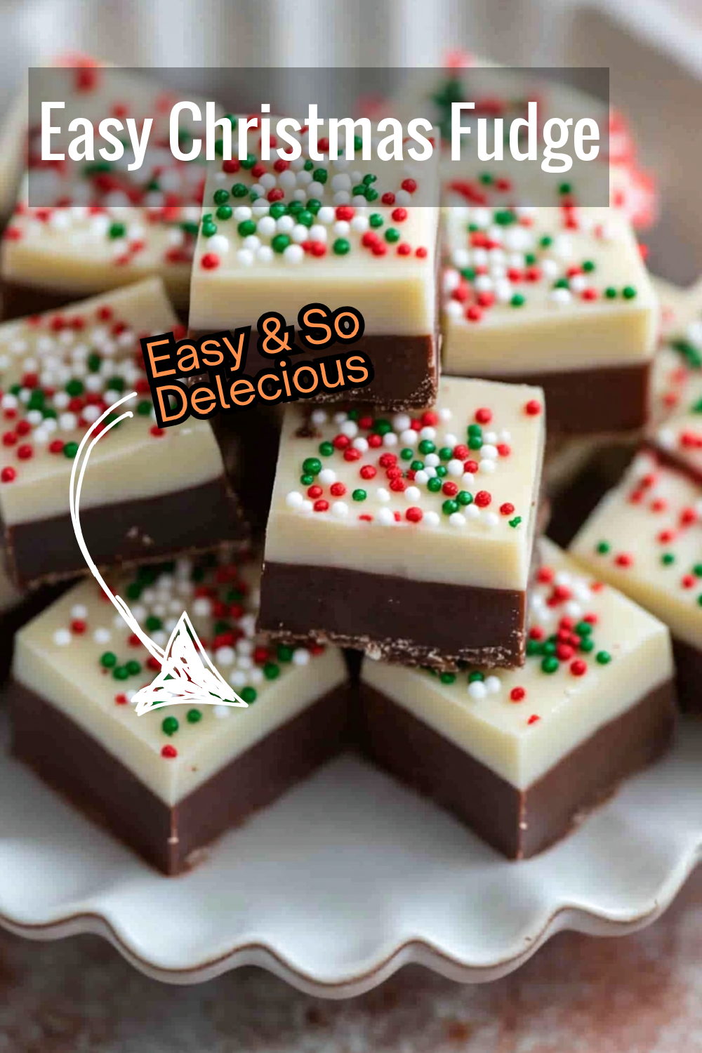 This easy Christmas fudge recipe combines two creamy chocolate layers with holiday sprinkles on top. A quick and delicious treat for holiday dessert tables!