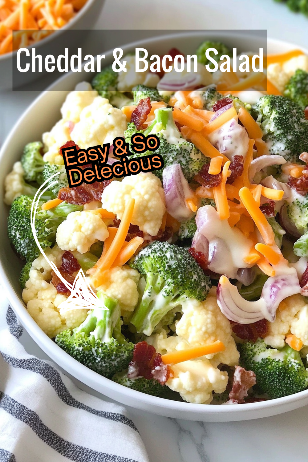 Satisfy cravings with this salad loaded with cheddar cheese, crispy bacon, and crunchy vegetables, all tossed in a flavorful dressing.