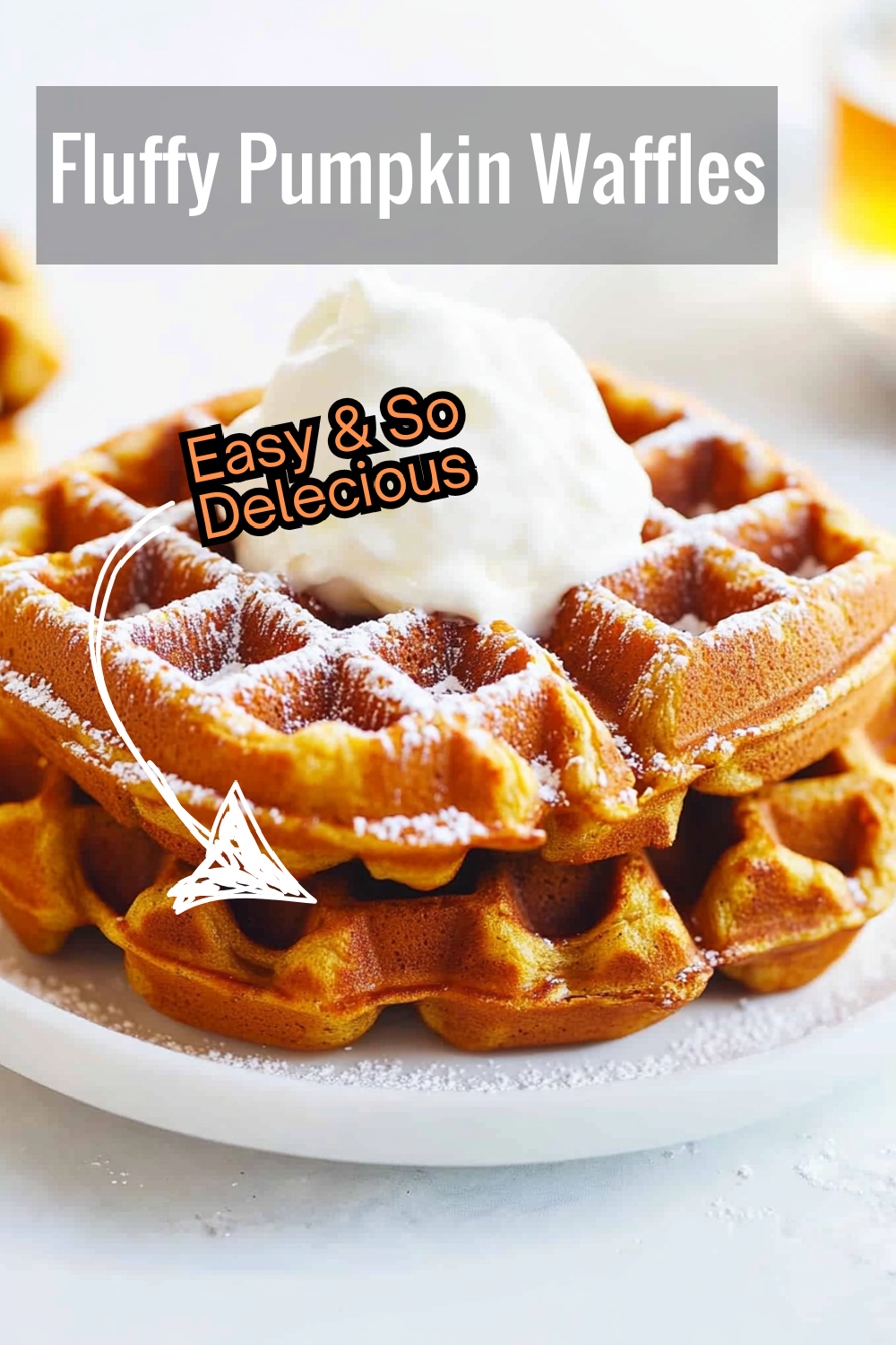 This easy pumpkin waffles recipe delivers light, fluffy waffles with a crispy exterior, perfectly paired with whipped cream and syrup for a touch of sweetness.